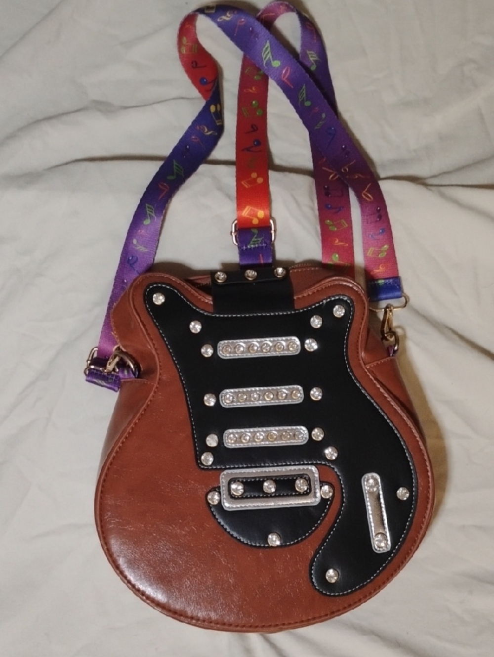 Brown and Black Guitar-Shaped Crossbody Bag with Colorful Strap